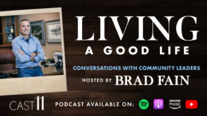 Brad leans on a desk in a framed polaroid picture and shows "Living a Good Life" text to promote the podcast