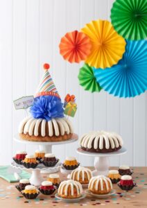 Nothing Bundt Cakes birthday display is set up.