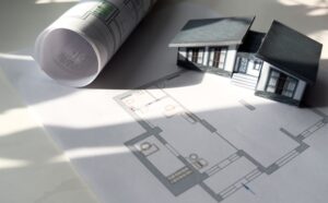 model house with blueprints