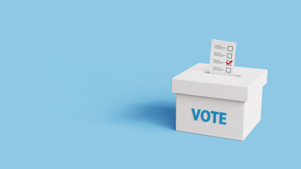 Vote into a ballot box during elections