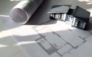 model house with blueprints